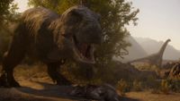 A screenshot from Netflix's documentary "The Dinosaurs" showing a T-rex stood over a dead dinosaur, with a large sauropod in the background.