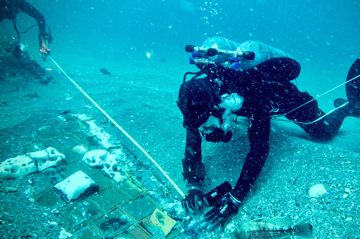 Underwater explorer and marine biologist Mike Barnette and wreck diver Jimmy Gadomski explore a segment of NASA&#039;s fallen space shuttle Challenger, which the team discovered in the waters off the coast of Florida during film of The History Channel new series &quot;The Bermuda Triangle: Into Cursed Waters.&quot;