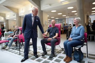 King Charles holds hands with cancer patients at University College Hospital Macmillan Cancer Centre