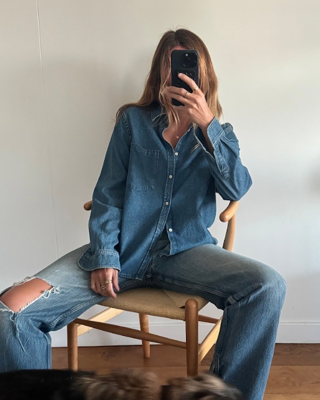 Angie wears a denim shirt from With Nothing Underneath