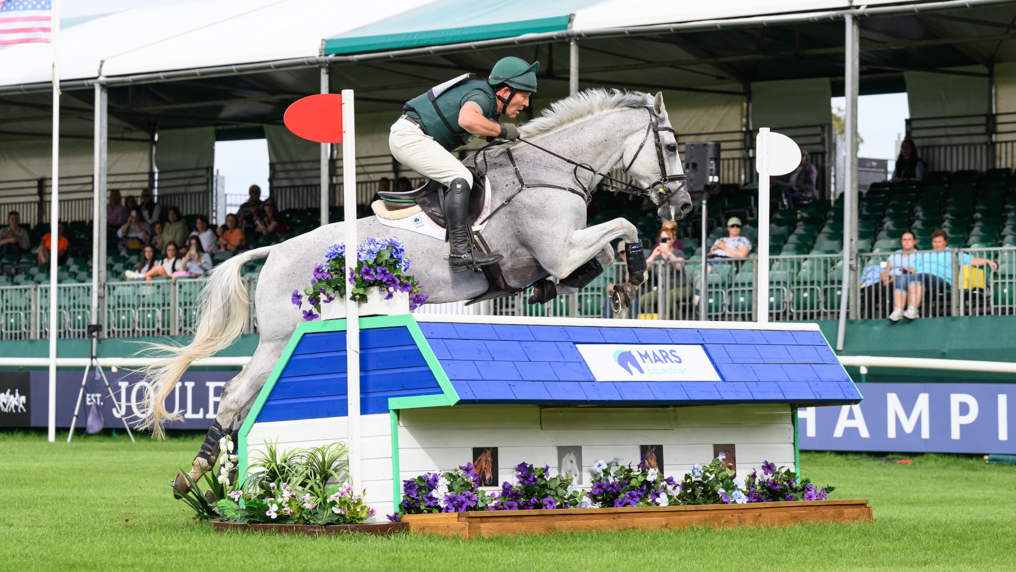 Austin O&rsquo;Connor and Colorado Blue clear a large table fence at Burghley