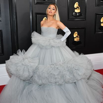 Ariana Grande dressed in a Disney style gown on the red carpet at the Grammys.