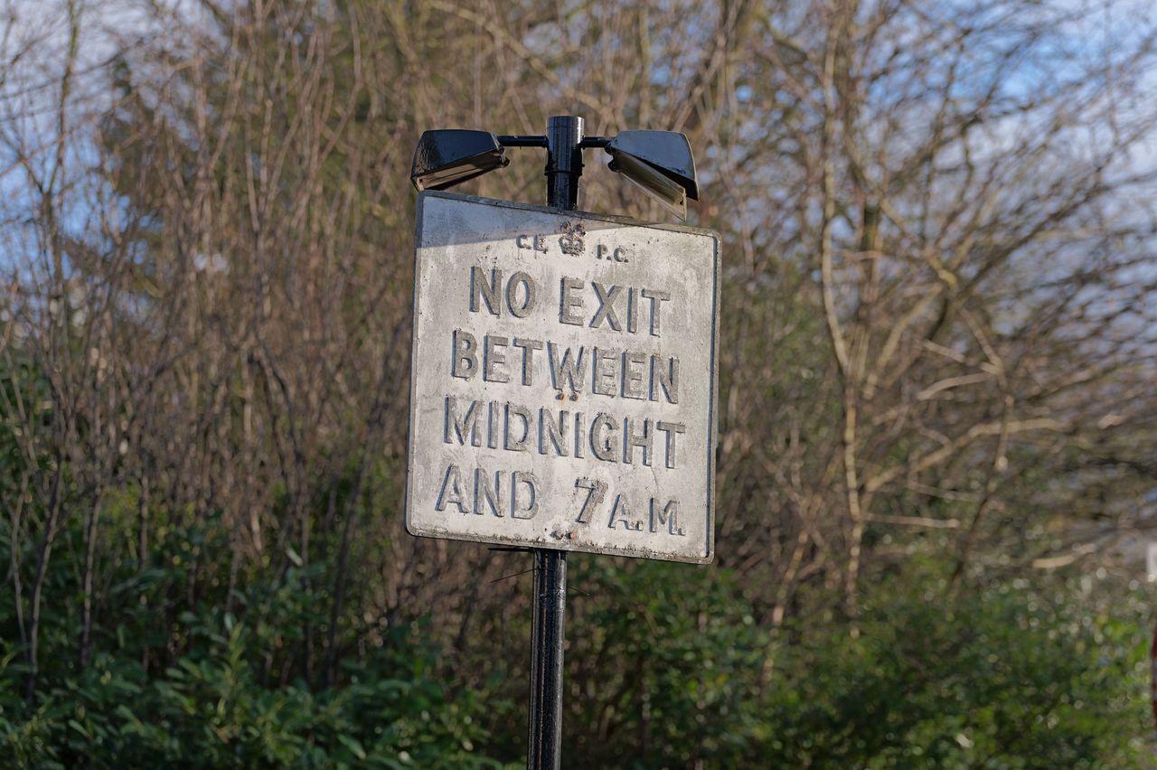 A sign reading no exit between midnight and 7am