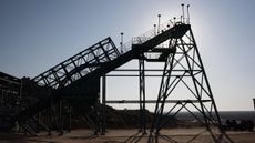 A silhouette of the headgear at Steenkampskraal rare-earth mine in South Africa