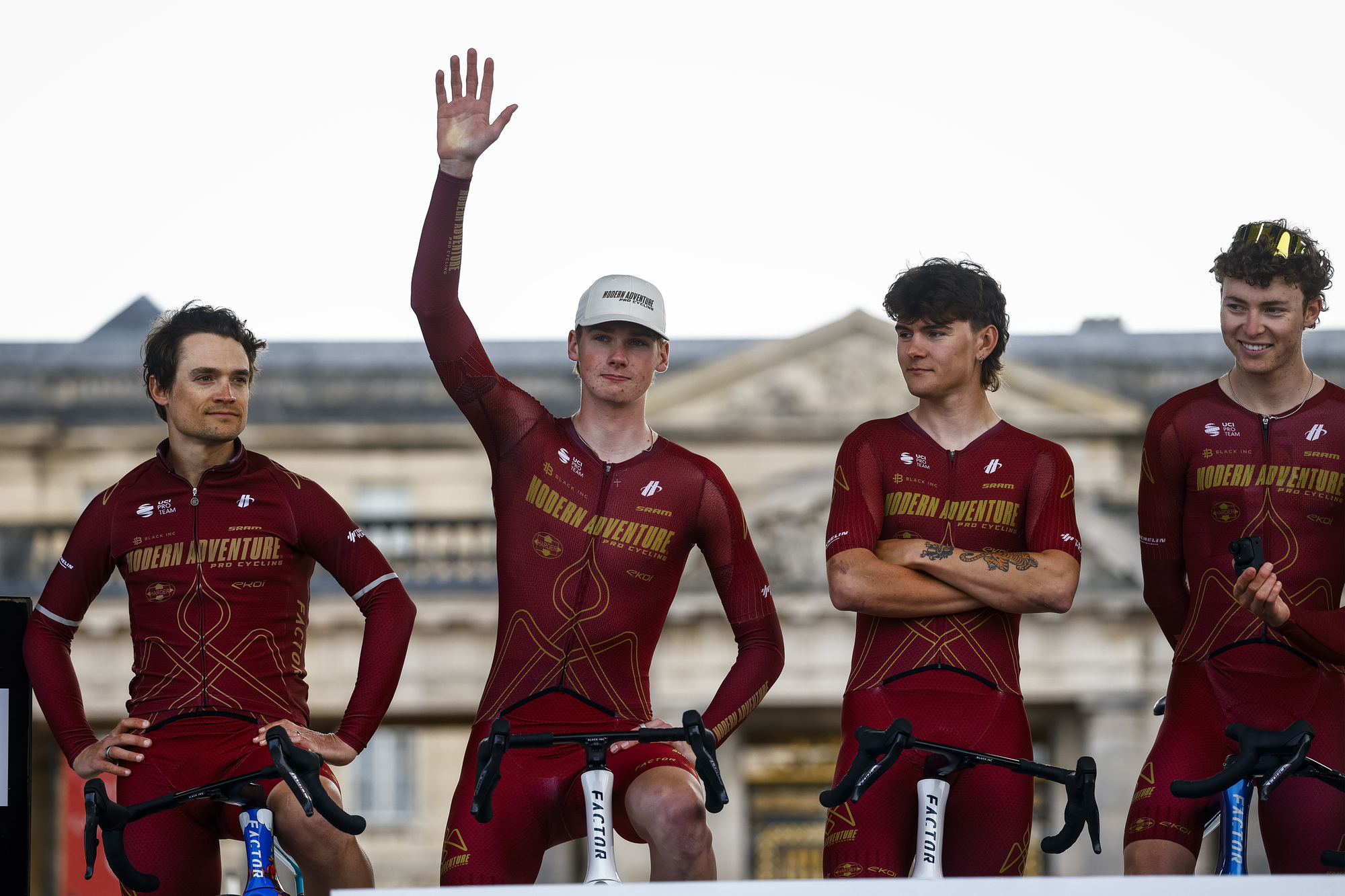 Ezra Caudell waves at the Paris-Roubaix team presentation