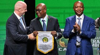 Ivory Coast's Football Federation president Yacine Idriss Diallo (C) pose with African Confederation of Football (CAF) president Patrice Motsepe (R) and FIFA president Gianni Infantino (L) during the CAF 45th Ordinary General Assembly in Abidjan in Ivory Coast on July 13, 2023.