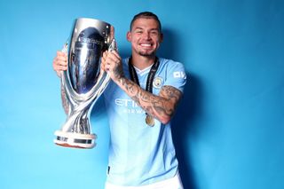 Kalvin Phillips of Manchester City poses with the Super Cup Trophy at the winners shoot after winning the UEFA Super Cup 2023 match between Manchester City FC and Sevilla FC at Karaiskakis Stadium on August 16, 2023 in Piraeus, Greece.