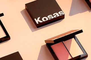 Kosas velvet cream highlighter and blush in black square case against beige background