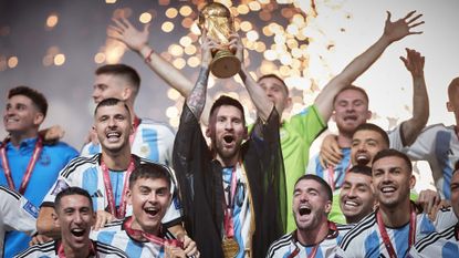 Lionel Messi of Argentina lifts the World Cup trophy at Qatar 2022