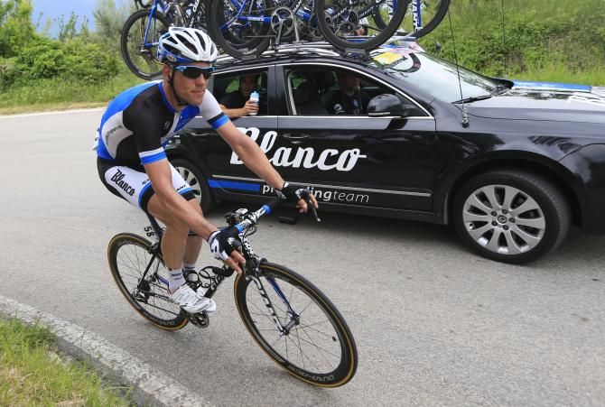 Maarten Tjallingii goes back to the Blanco team car during the stage