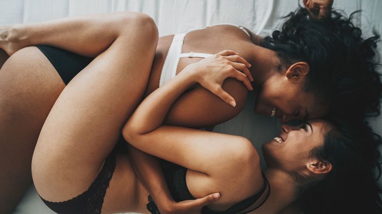 lesbian couple in bed