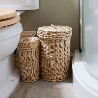 bathroom with two basket near commode