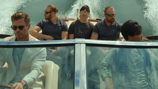 Chris Hemsworth as Abnesti, Miles Teller as Jeff and Mark Paguio as Verlaine on a speedboat in Spiderhead