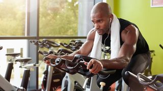 Man using an exercise bike in the gym