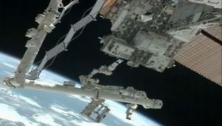 The Dextre robot on the International Space Station is seen near the Robotic Refueling Mission testbed outside the International Space Station in this camera view in January 2012.