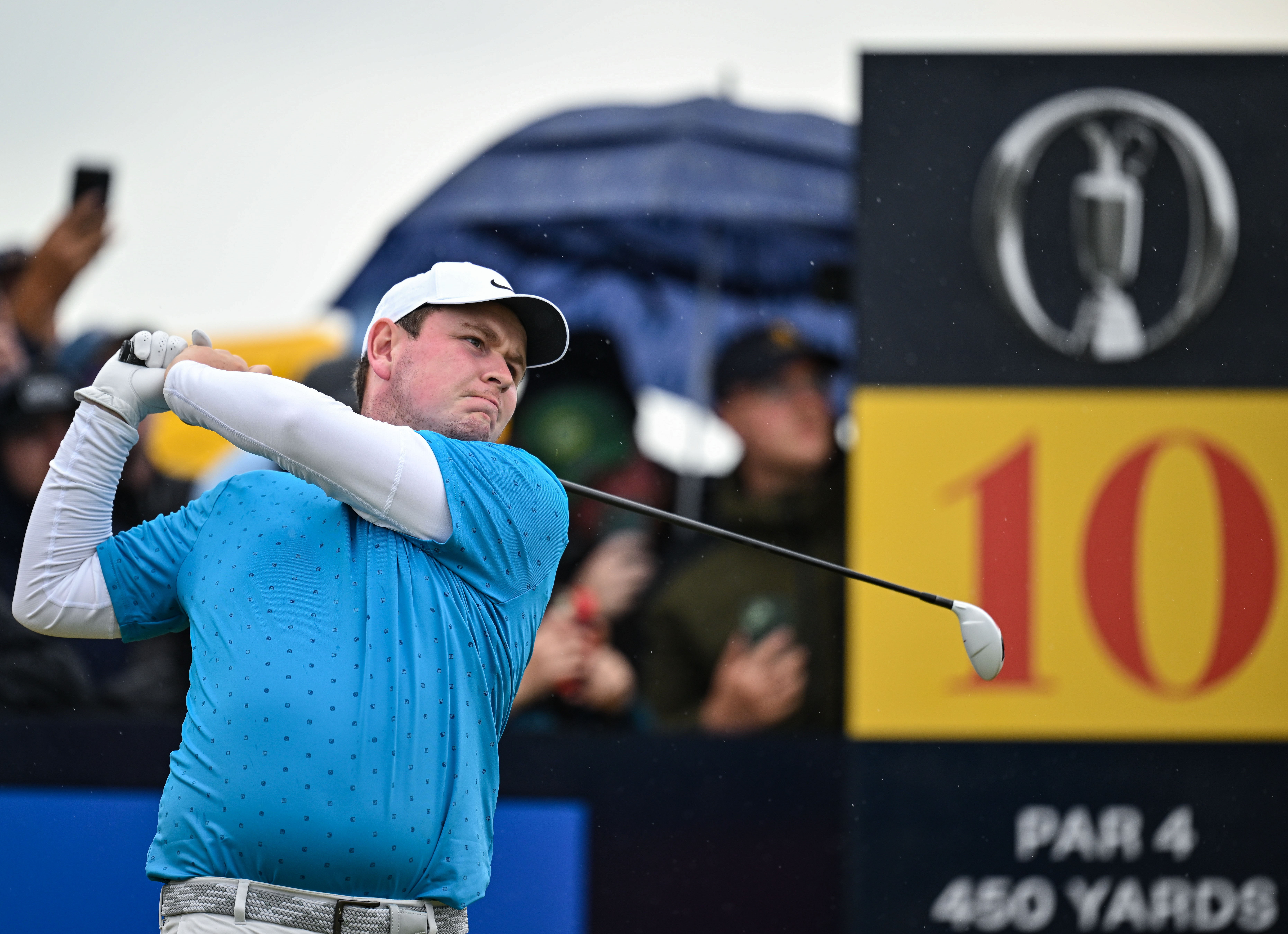 Robert MacIntyre hits a fairway wood at The Open
