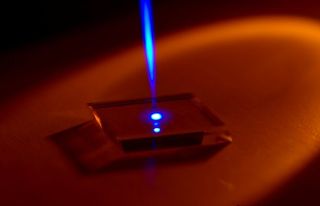 UV laser beam on synthetic diamond.