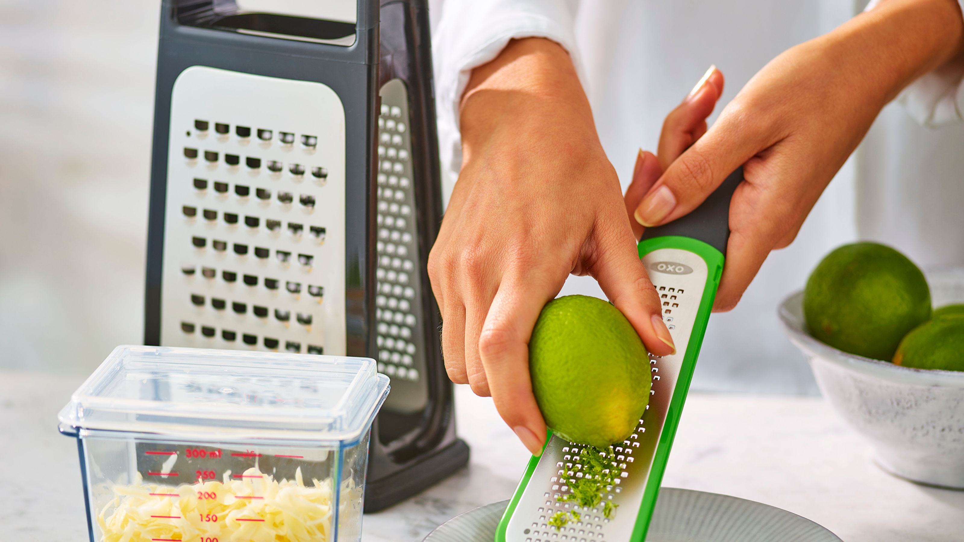OXO cheese grater zesting a lime.