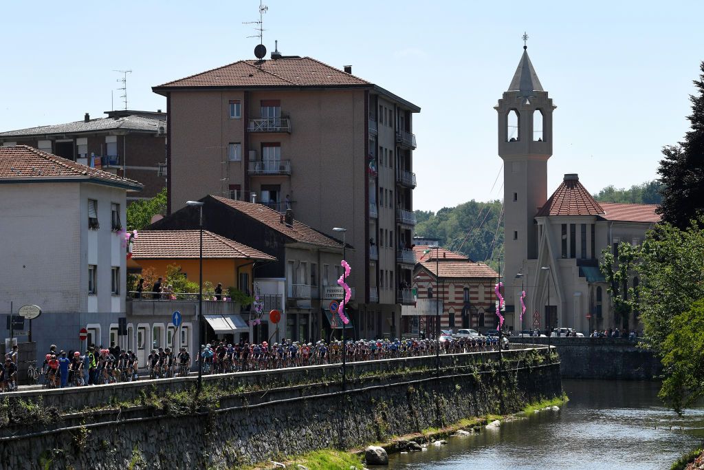 ALPE DI MERA VALSESIA ITALY MAY 28 The peloton passing through Borgomanero Village 309m landscape during the 104th Giro dItalia 2021 Stage 19 a 166km stage from Abbiategrasso to Alpe di Mera Valsesia 1531m Stage modified due to the tragic events on May the 23rd 2021 that involved the Mottarone Cableway UCIworldtour girodiitalia Giro on May 28 2021 in Alpe di Mera Valsesia Italy Photo by Tim de WaeleGetty Images