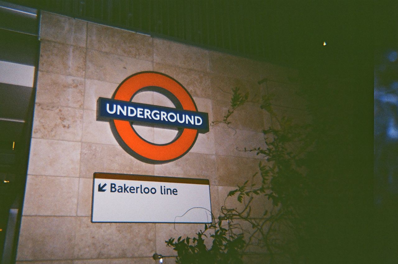 A photo of a London underground sign taken on a Novocolor Swiss+Go 35mm film camera