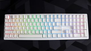 Ducky Zero 6108 gaming keyboard in white on a desk.