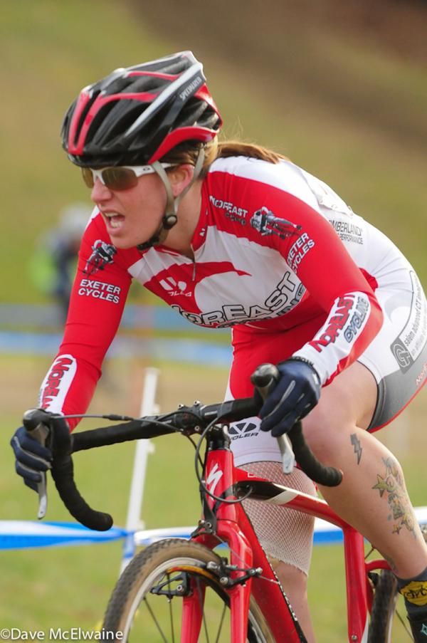 A Northeast Cycling racer riding with a bandaged leg