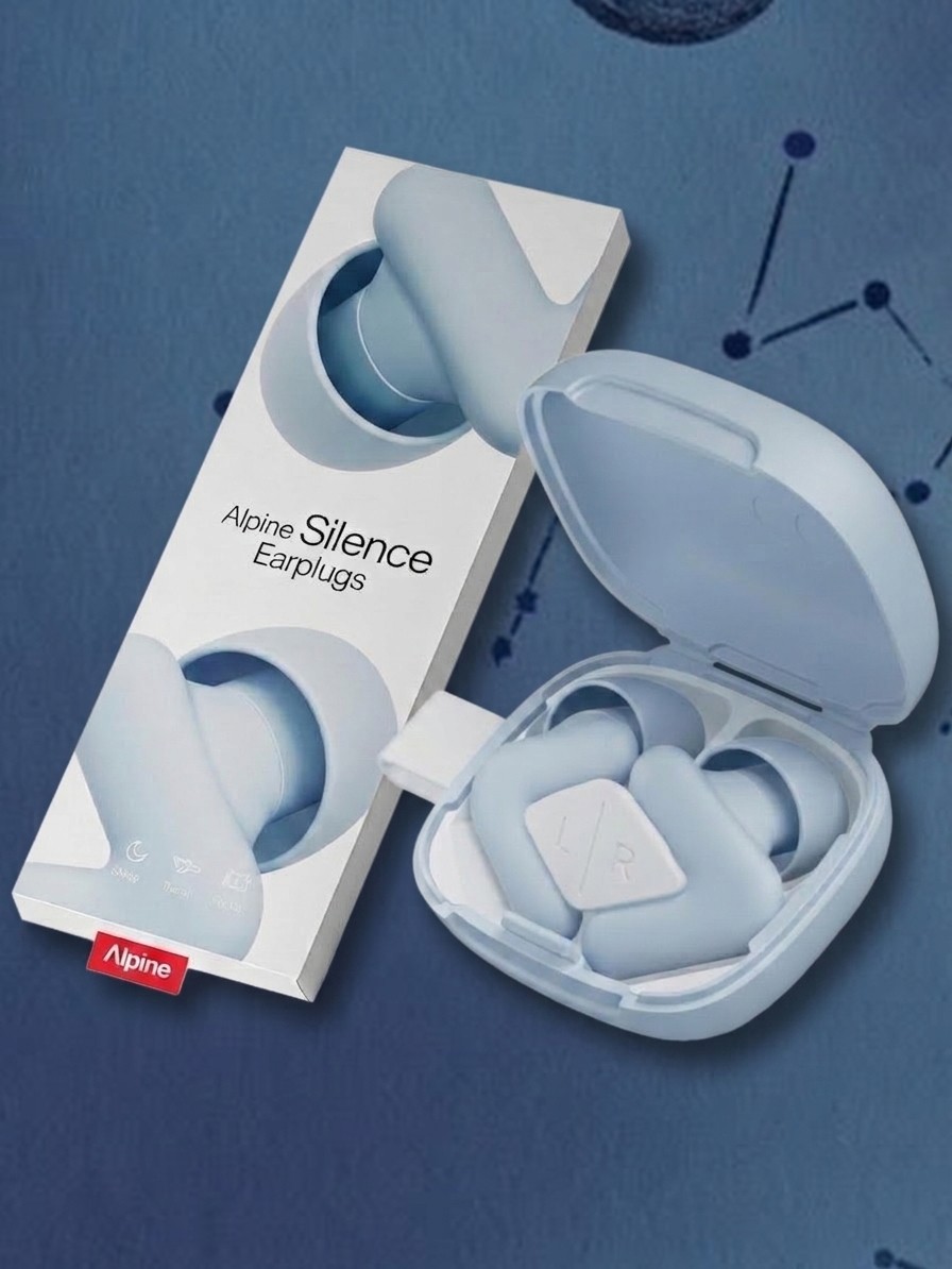 An open case showing the Alpine Silence earplugs plus their packaging against a blue background of stars, edited by Gemini
