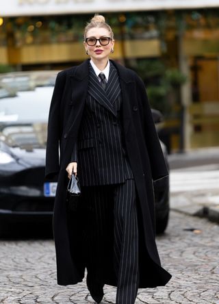 French street style - woman wearing a pinstripe suit