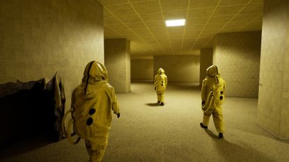 Screenshot from Backrooms: Escape Together, showing three characters in yellow hazmat suits walking through an empty, all-yellow building.