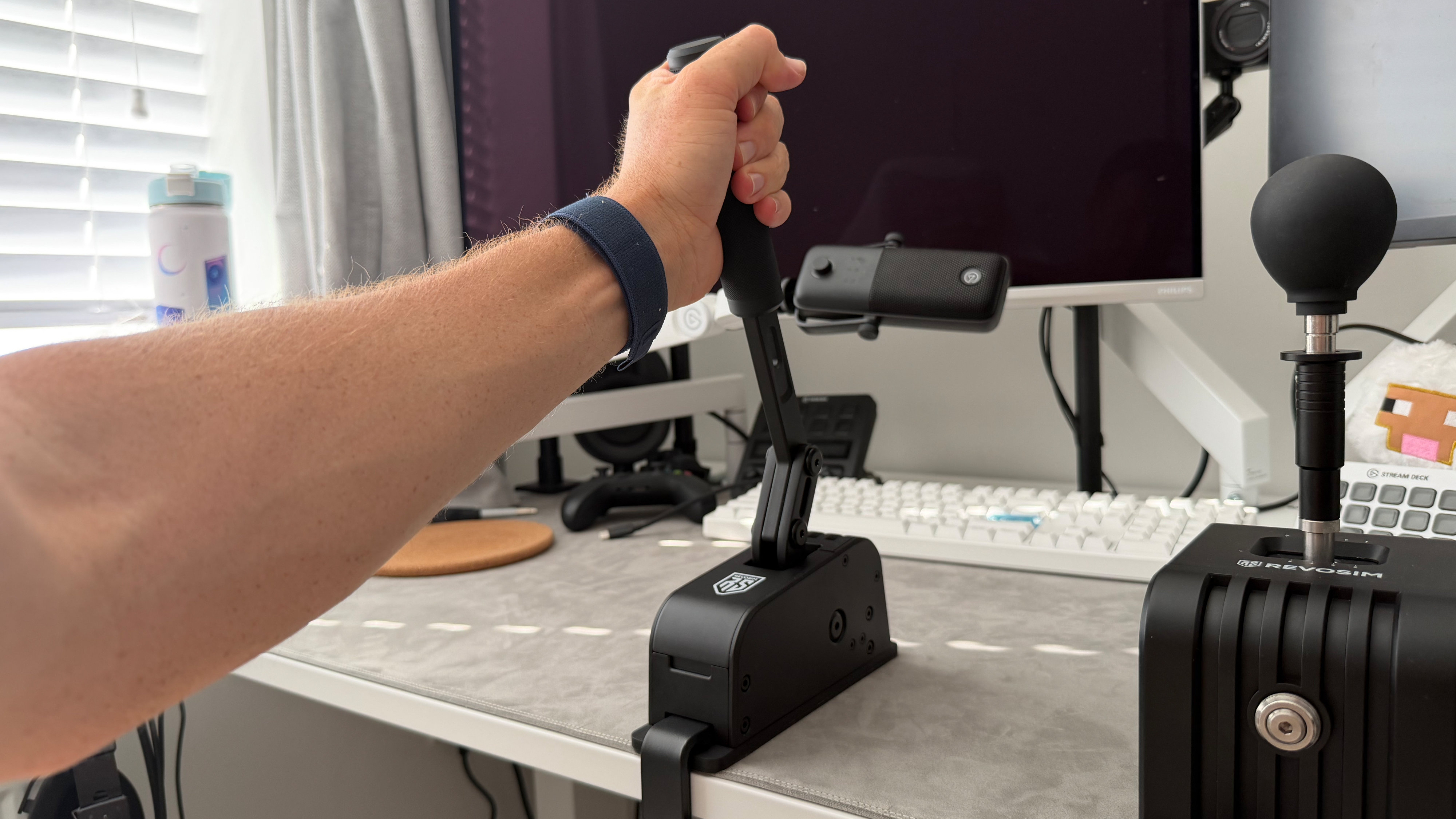 A reviewer working the hand brake on the Revosim's RS Pure bundle