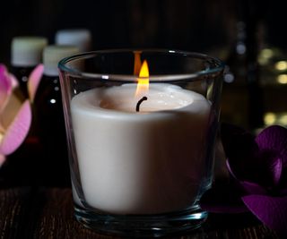 A candle in a glass vessel