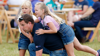Peter Phillips and daughters Isla Phillips (L) and Savannah Phillips (R) attend day 1 of the 2019 Festival of British Eventing at Gatcombe Park on August 2, 2019 in Stroud, England