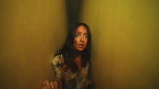 Renate Reinsve with blood on her face and looking very scared in Backrooms
