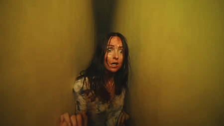Renate Reinsve with blood on her face and looking very scared in Backrooms