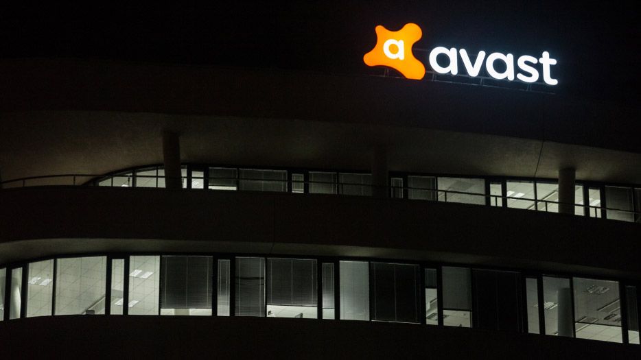 Avast logo on a building at night.