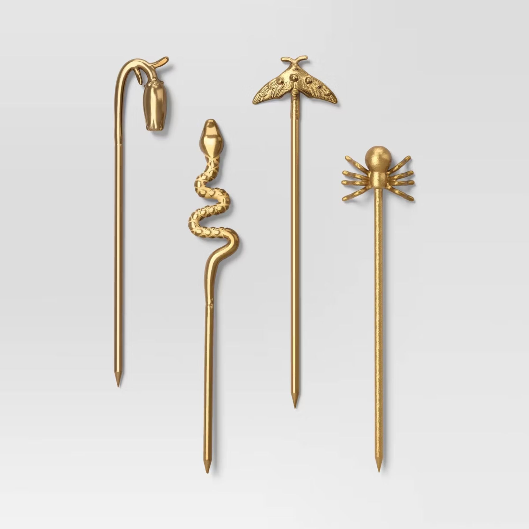 Gold cocktail picks with insect designs