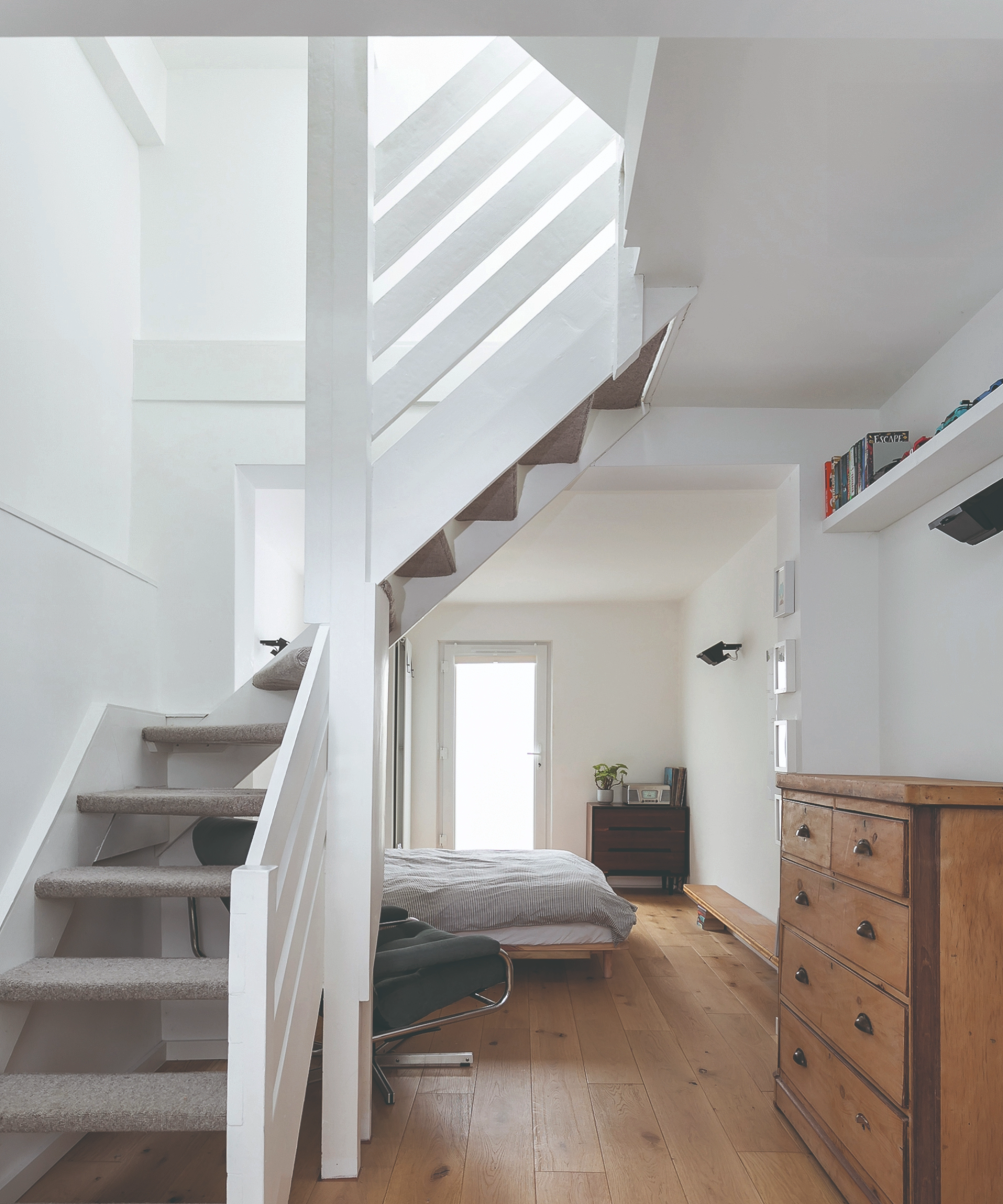 View from the bottom of the staircase which leads onto a bedroom