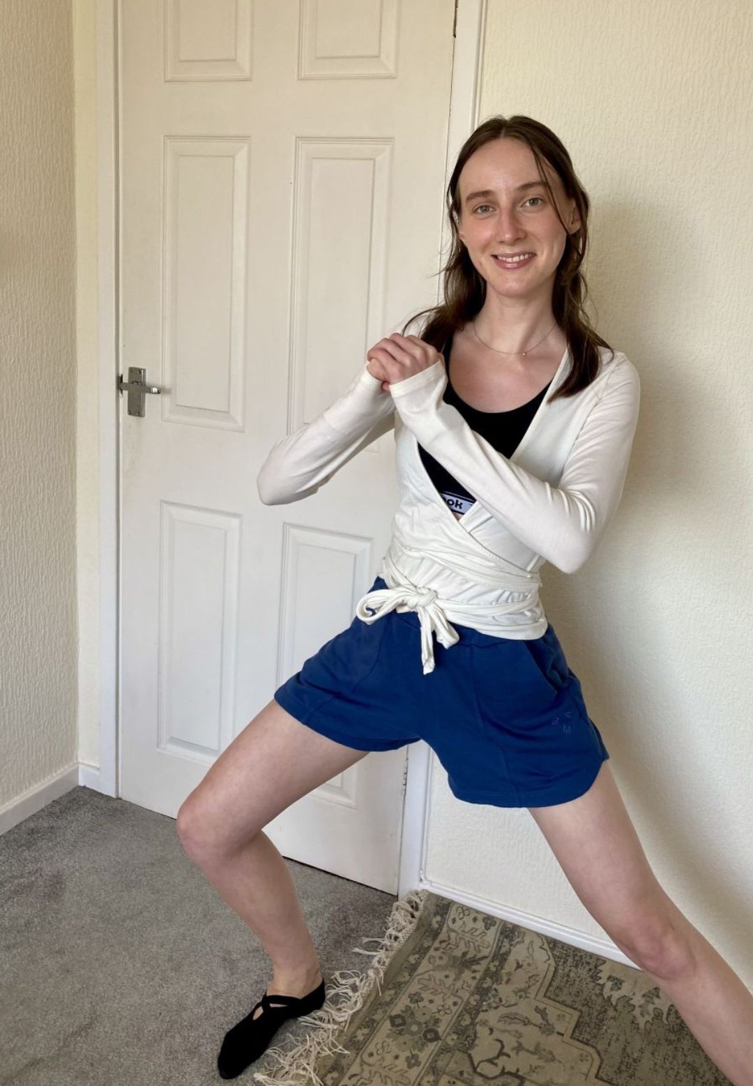Health writer Katie Sims trying standing Pilates at home after seeing it go viral on social media