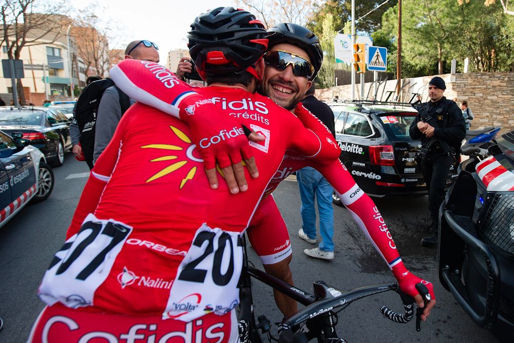 Cofidis' French cyclist Nacer Bouhanni (R) celebrates with teammate Cofidis' Spanish rider Daniel Navarro after winning the fourth stage of the 97th Volta Catalunya