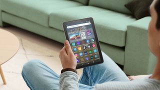 The Amazon Fire HD 8 Plus (2022) vertically in hand