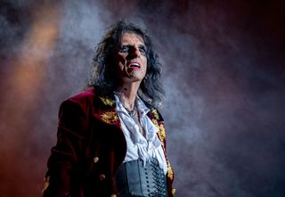 A picture of Alice Cooper on stage