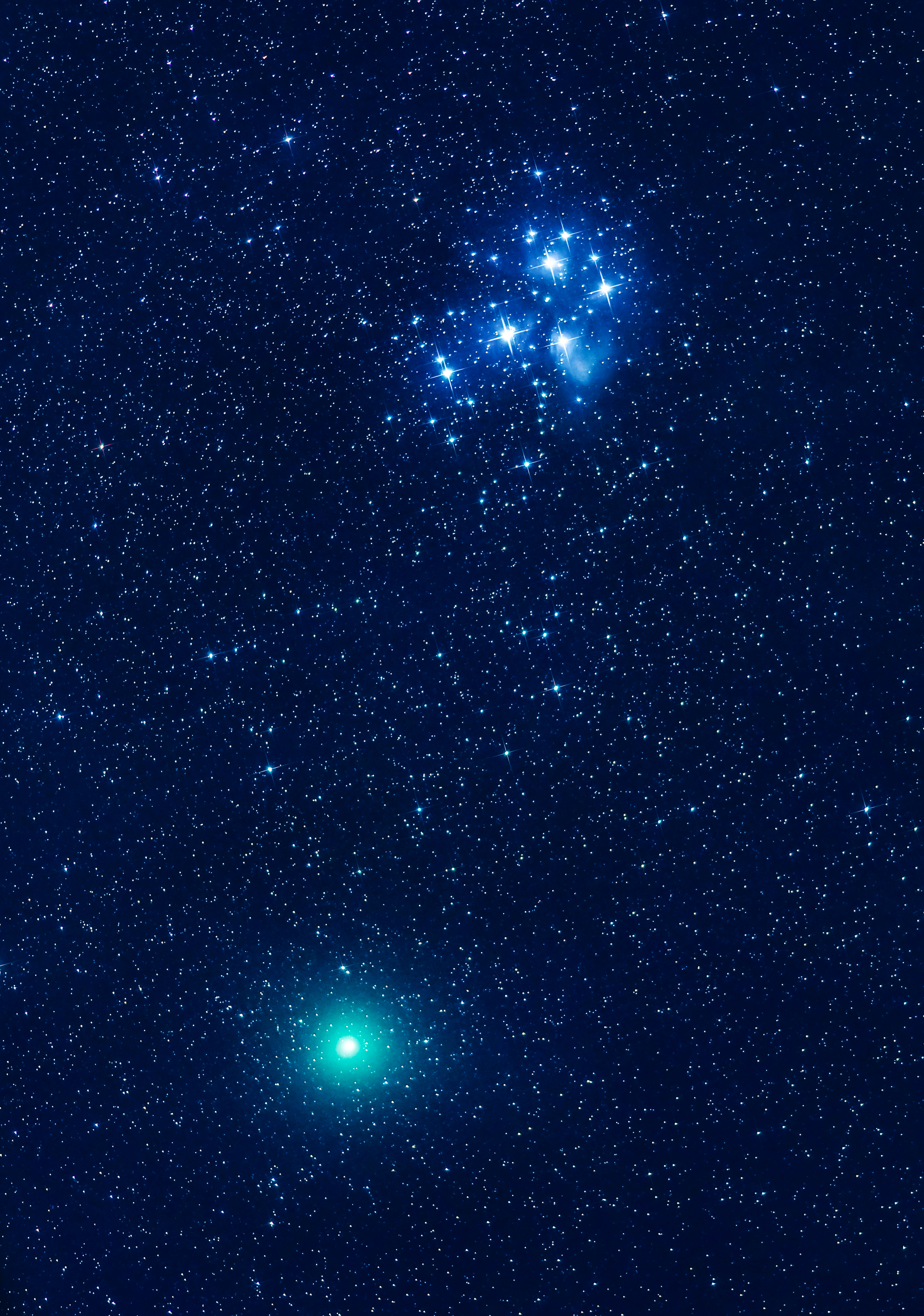 Comet Wirtanen 46P on December 15, 2018 taken in the blue-sky moonlight, with the first quarter Moon still well up in the southwest, and when the comet was passing near the Pleiades star cluster, Messier 45, in Taurus. Some high cloud and haze was just beginning to move in, thwarting any further efforts to shoot the scene under darker skies later that night after moonset.