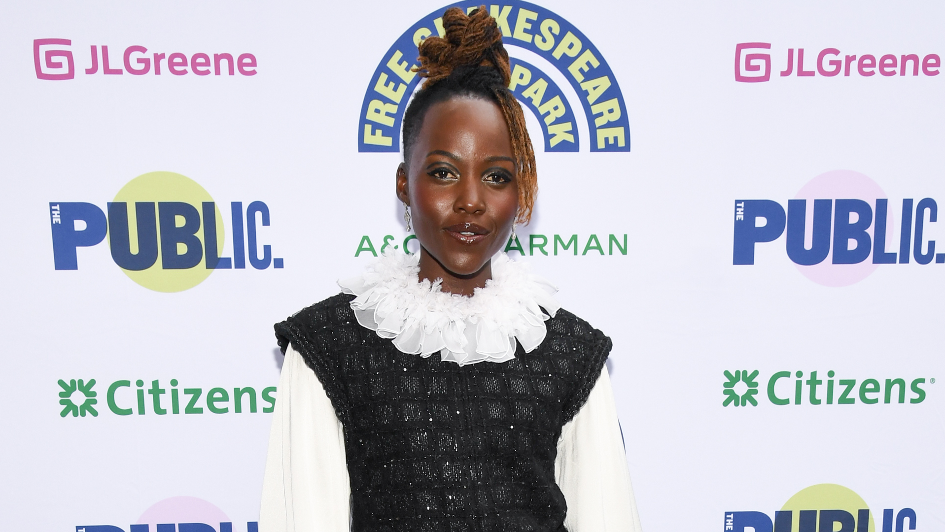 Lupita Nyong'o attended a Shakespeare in the Park event in a ruffled white-and-black dress