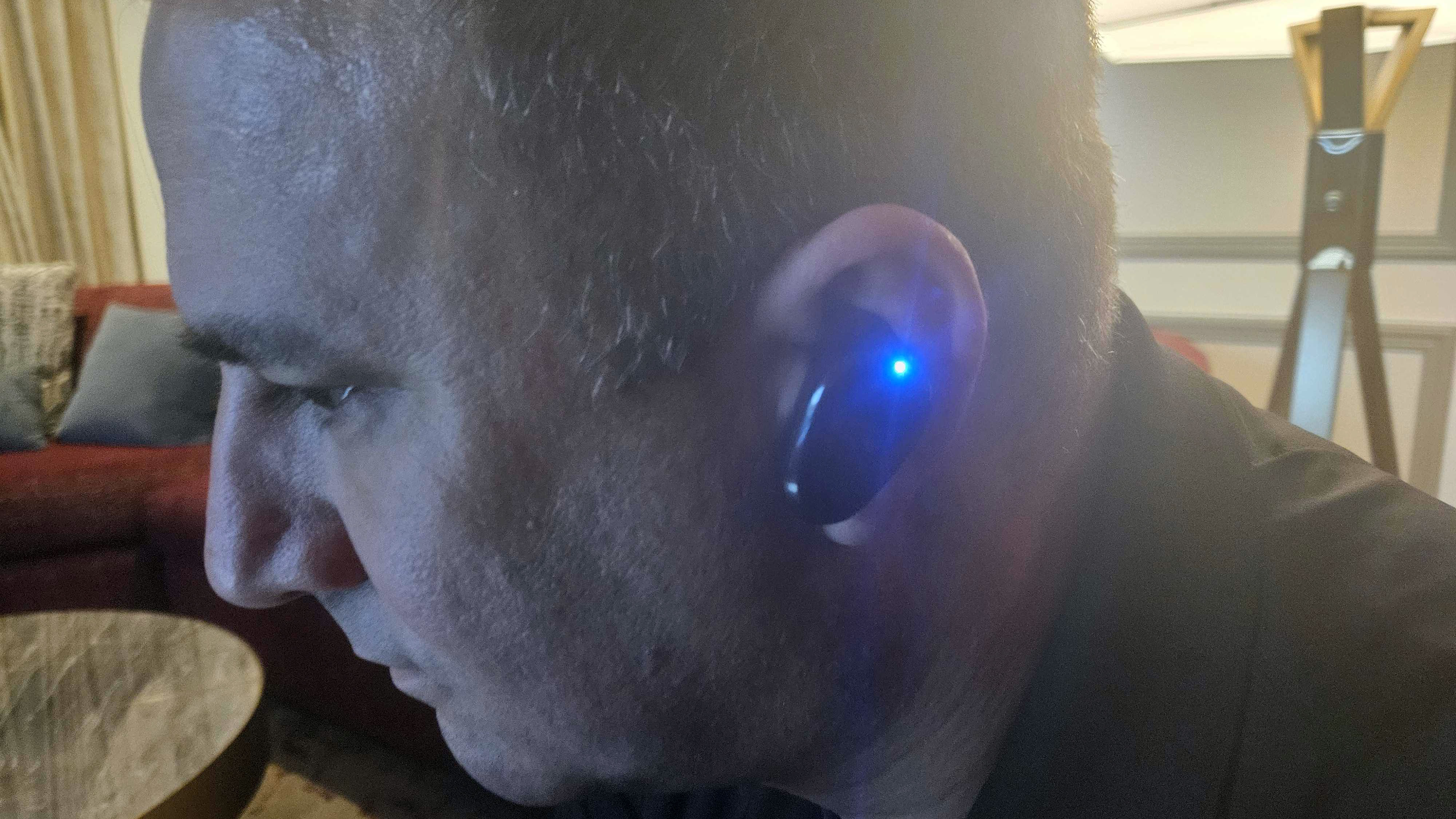 Naqi Neural Earbuds worn by a man at CES 2025