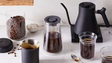 Some of the best gifts for coffee lovers: the Fellow Stagg Gooseneck Kettle with coffee and coffee beans around it