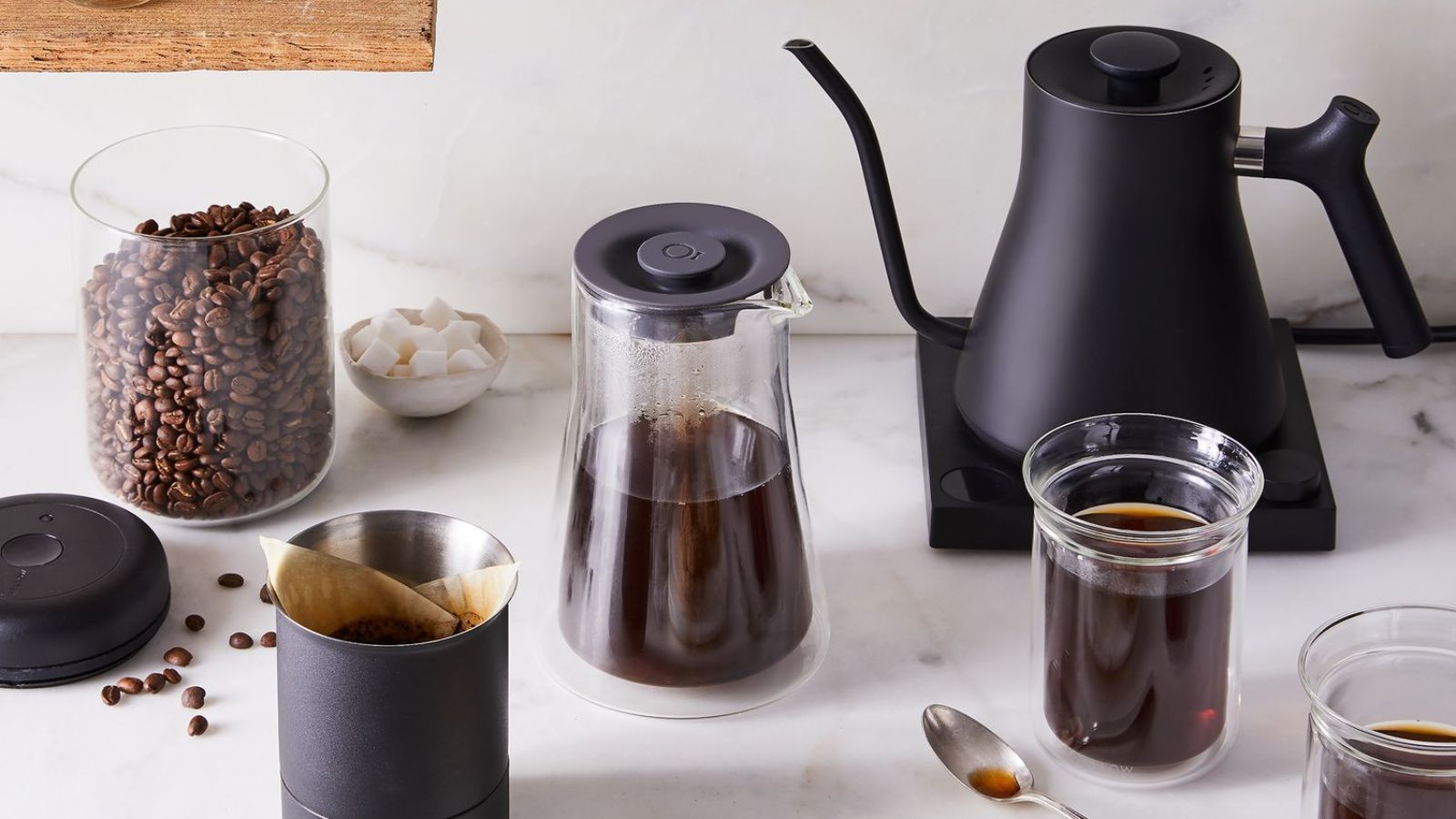 Fellow Stagg Gooseneck Kettle with coffee and coffee beans around it
