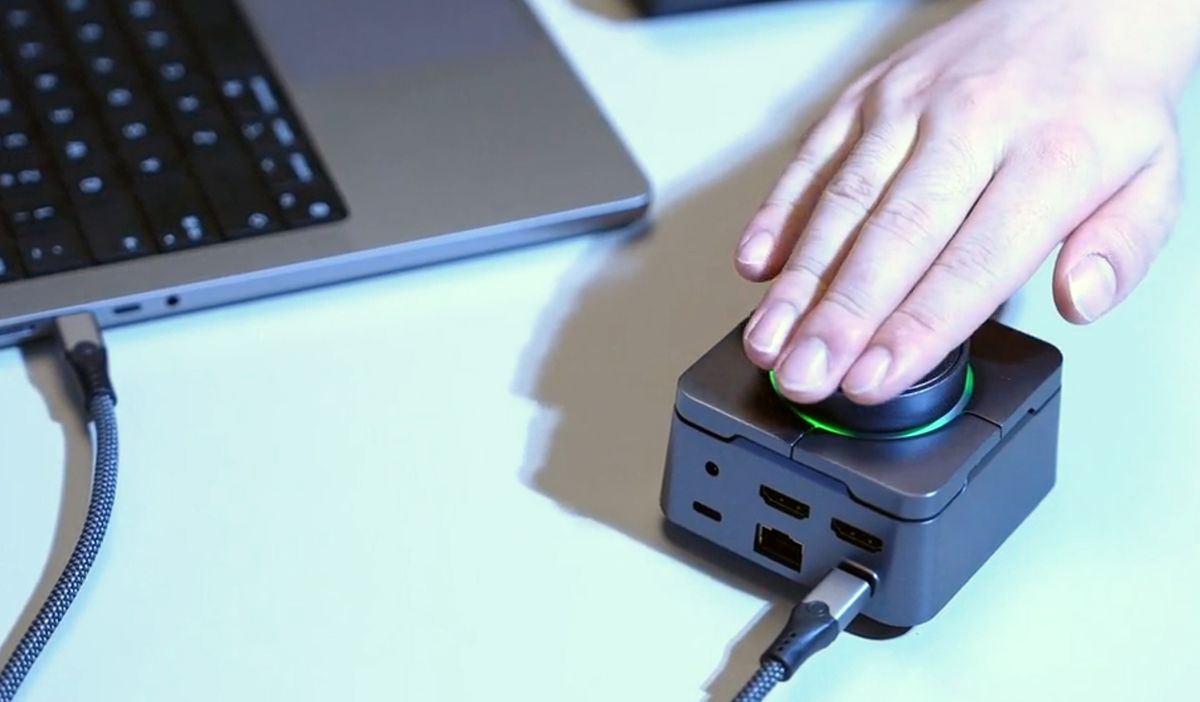 What a knob! Startup shoves circular controller in tiny laptop dock to create perfect desktop companion — shame you have to wait four months to get it