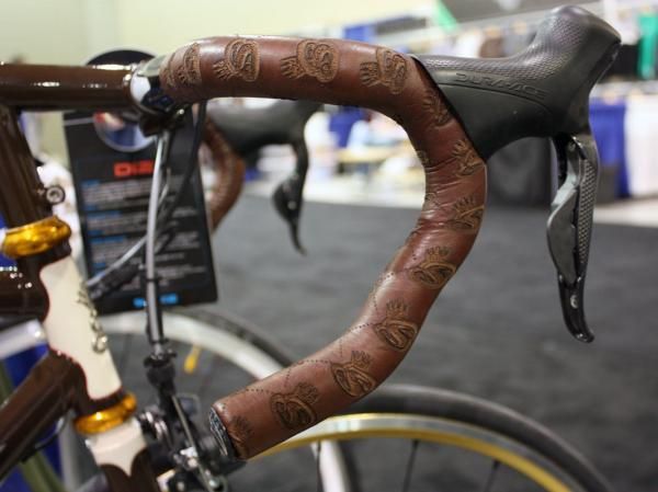 The stitched-on leather bar wrap was custom branded witih the SyCip logo.