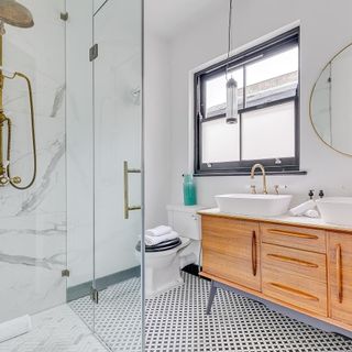 bathroom with printed flooring and grey windows