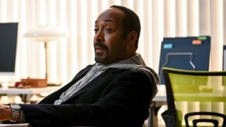 Jesse L. Martin sitting at desk as Alec in The Irrational